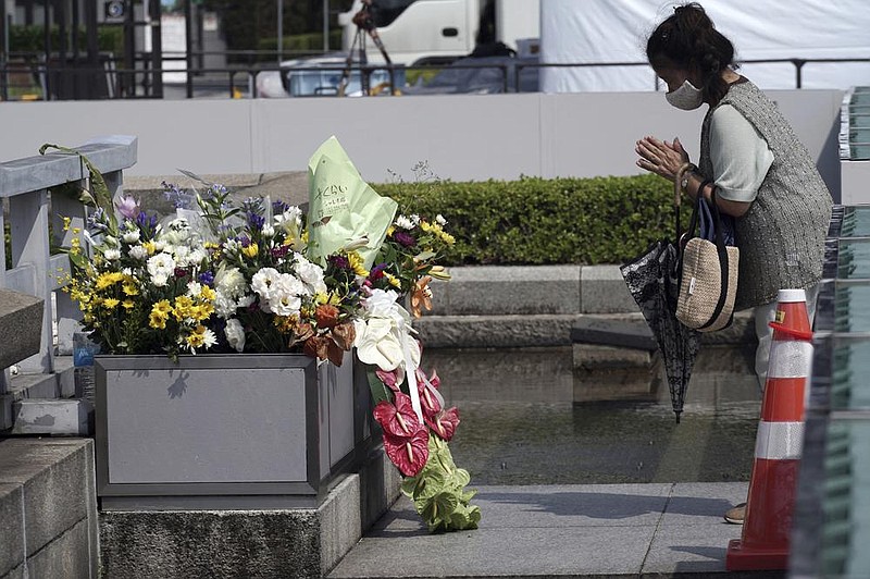 A visitor prays Wednesday at the cenotaph for the atomic bombing victims near Hiroshima Peace Memorial Museum in Hiroshima, Japan. Today is the 75th anniversary of the bombing.
(AP/Eugene Hoshiko)