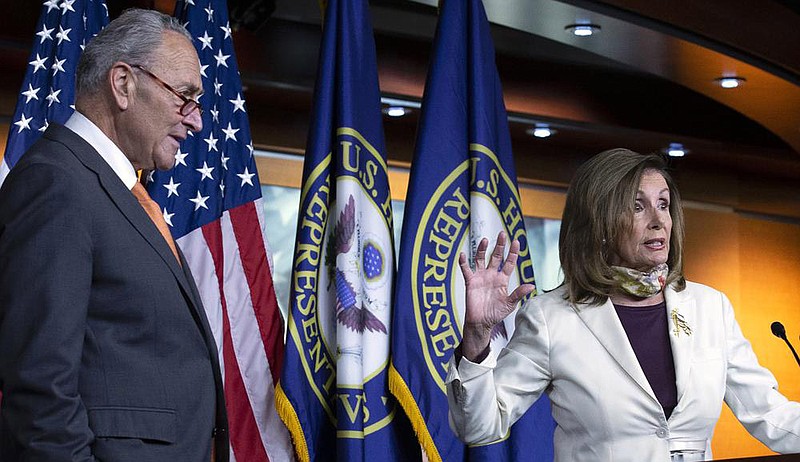 House Speaker Nancy Pelosi and Senate Minority Leader Charles Schumer discuss the stimulus negotiations Thursday after contentious meetings with White House officials. More photos at arkansasonline.com/87pelosi/.
(AP/Jose Luis Magana)