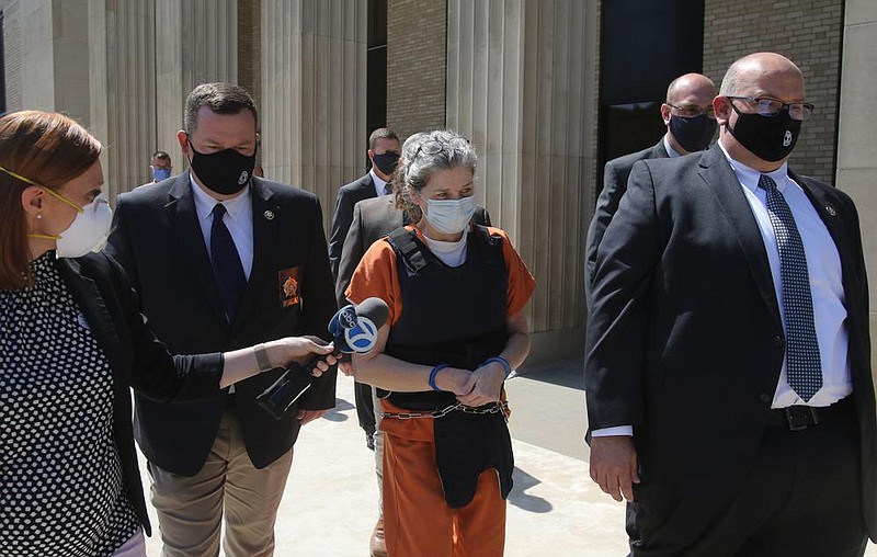 Law enforcement officials escort Rebecca O’Donnell out of the Randolph County Courthouse in Pocahontas on Thursday, Aug. 6, 2020, after she pleaded guilty to the murder of Linda Collins. Asked to explain to the court what she did, O’Donnell said, “I intentionally killed her.”
(Arkansas Democrat-Gazette/Thomas Metthe)