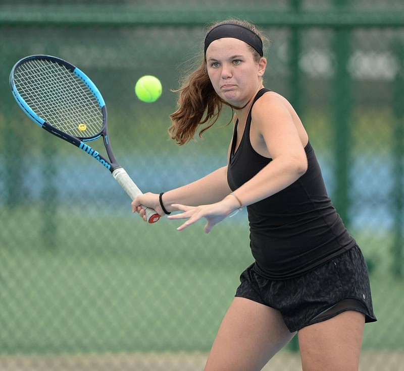 NWA Democrat-Gazette/ANDY SHUPE
Ella Coleman of Bentonville returns a shot Tuesday, Oct. 15, 2019, from Presley Southerland of Mount St. Mary during the Class 6A state tennis championship at Har-Ber High School in Springdale. Visit nwadg.com/photos to see more photographs from the matches.