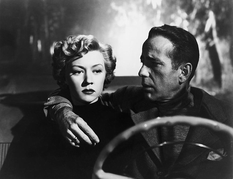 Laurel Gray (Gloria Graham) falls under the spell of unbalanced screenwriter Dixon Steele (Humphrey Bogart) in 1950’s “In a Lonely Place.”

