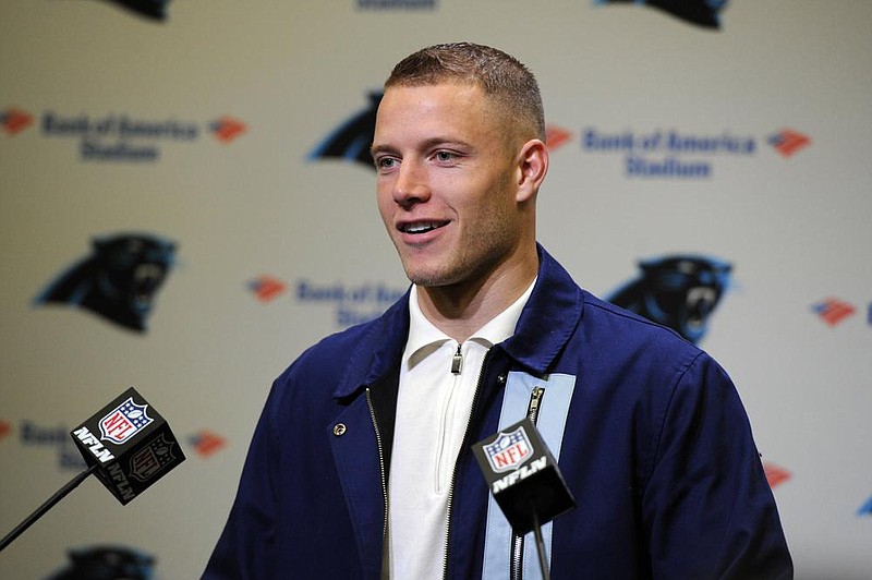 Carolina Panthers running back Christian McCaffrey (22) speaks to members of the media following an NFL football game against the New Orleans Saints in Charlotte, N.C., Sunday, Dec. 29, 2019. (AP Photo/Mike McCarn)