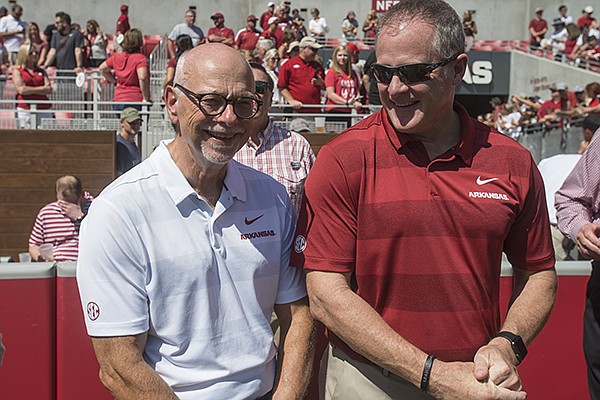 University of Arkansas chancellor Joseph Steinmetz (left) and athletics director Hunter Yurachek are shown during a game between the Razorbacks and Eastern Illinois on Saturday, Sept. 1, 2018, in Fayetteville. 