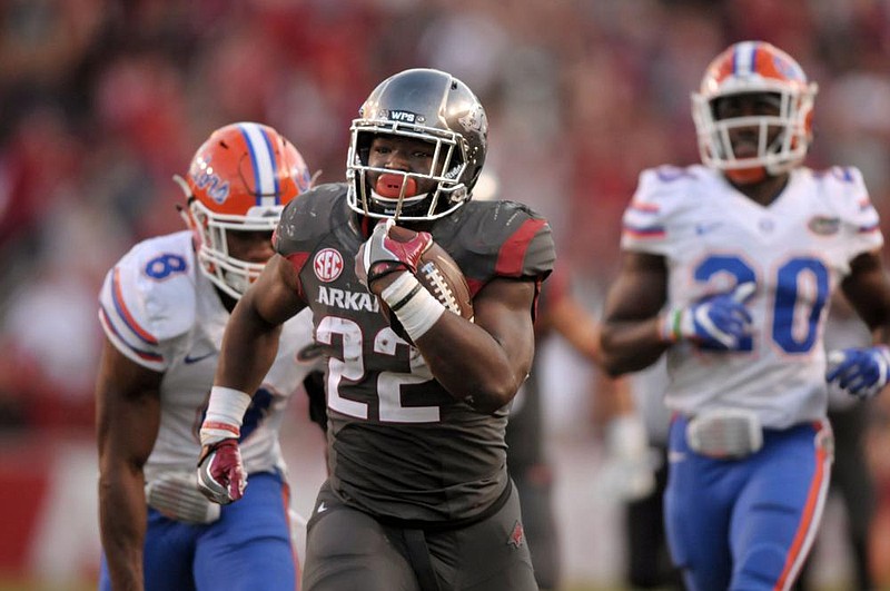 Rawleigh Williams of Arkansas breaks away for a touchdown during the Razorbacks’ 31-10 victory over Florida in 2016. The SEC announced Friday that Arkansas will play Florida on the road and Georgia at home this fall to complete a 10-game schedule.
(NWA Democrat-Gazette/Ben Goff)