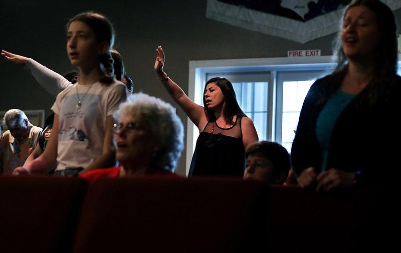 Worshippers including Cindy Meddinna (center) gather for worship services at Bundy Canyon Christian Church in Wildomar, Calif., on Sunday.
(Los Angeles Times/Christina House)