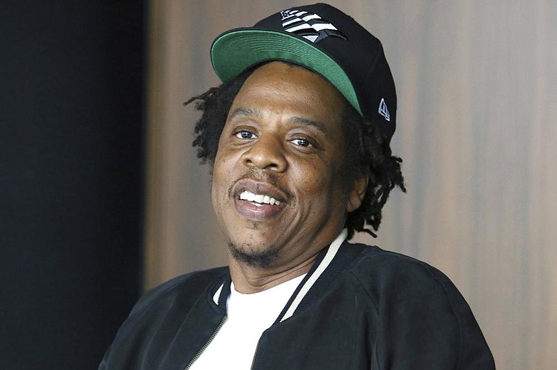 FILE - In this July 23, 2019, file photo, Jay-Z makes an announcement of the launch of Dream Chasers record label in joint venture with Roc Nation, at the Roc Nation headquarters in New York. Jay-Zâ€™s Roc Nation entertainment company is partnering with Brooklynâ€™s Long Island University to launch the Roc Nation School of Music, Sports & Entertainment. The new school will begin enrolling students for the fall 2021 semester, and 25% of the incoming freshmen class will receive Roc Nation Hope Scholarships. (Photo by Greg Allen/Invision/AP, File)