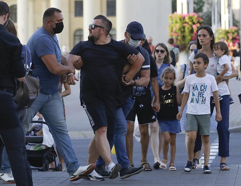 Police detain a protester Saturday as clashes break out during a demonstration in Beirut against the Lebanese government and its political elites. More photos at arkansasonline.com/89beirut/. (AP/Thibault Camus) 