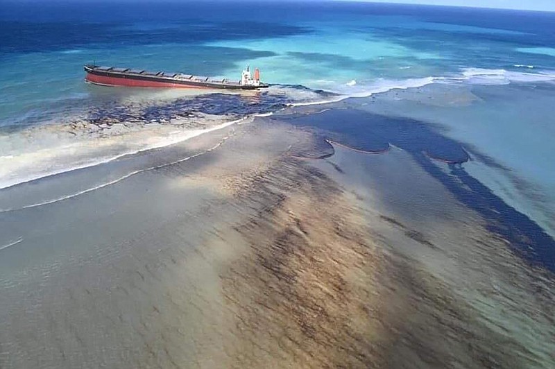 Oil leaks Friday from the MV Wakashio, a bulk carrier ship that ran aground last month on a reef off the coast of Mauritius. (AP/MU press/Georges de La Tremoille) 