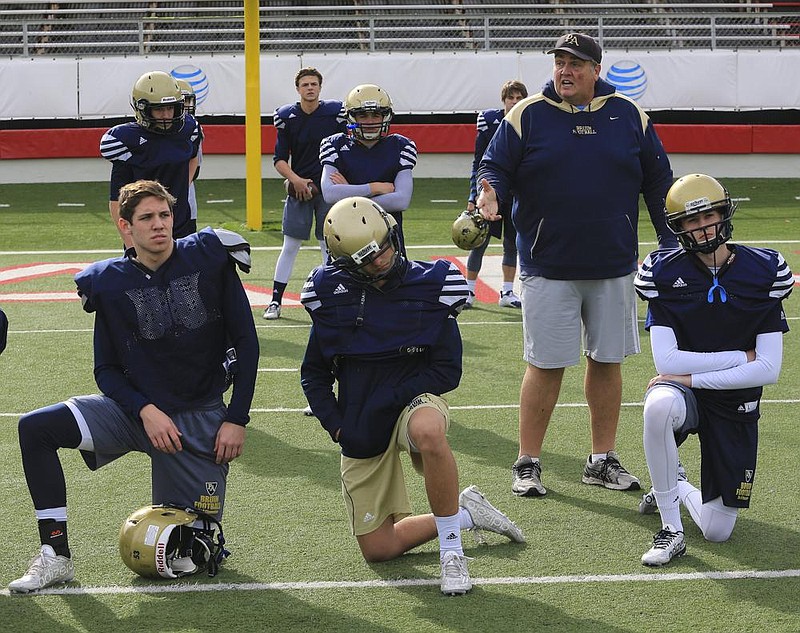 Todd Wood (second from right), shown here as Pulaski Academy’s defensive coordinator in 2015, is getting his first opportunity as a head coach at Heber Springs, which is coming off a 4-7 season.
(Democrat-Gazette file photo)