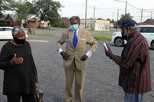 Former election coordinator Joyce Campbell (from left), election commissioner Ted Davis and current election coordinator George Stepps talk outside the Jefferson County Election Commission office after a special meeting Aug. 8.
(Arkansas Democrat-Gazette/Dale Ellis)