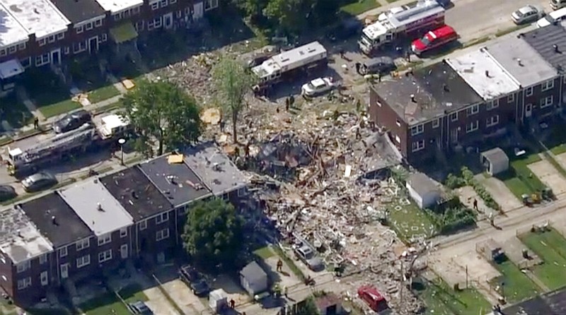This photo provided by WJLA-TV shows the scene of an explosion in Baltimore on Monday, Aug. 10, 2020. Baltimore firefighters say an explosion has leveled several homes in the city. (WJLA-TV via AP)