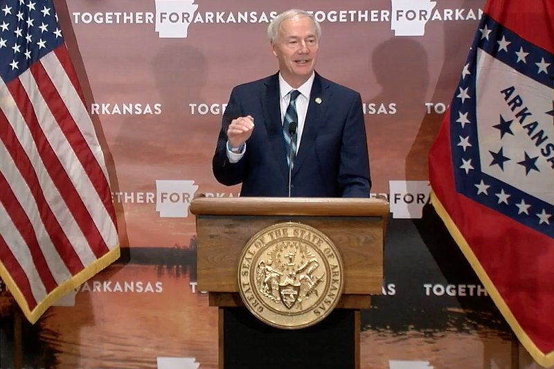 Arkansas Gov. Asa Hutchinson speaks to reporters at the state Capitol in Little Rock on Monday in this still of video provided by the governor's office. 