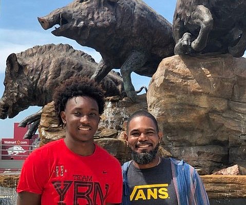 Arkansas basketball commit Chance Moore and his father, John, during their recent visit to Fayetteville.