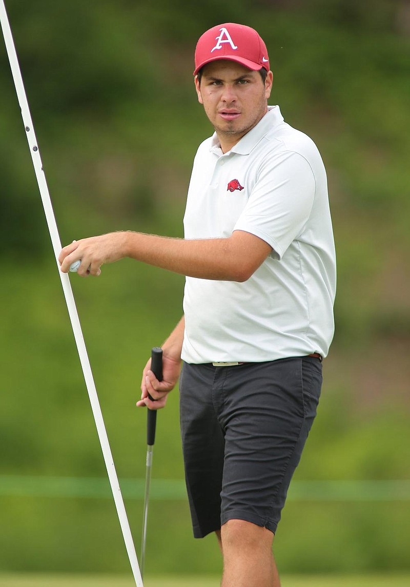 NWA Democrat-Gazette/DAVID GOTTSCHALK Unviversity of Arkansas' Julian Perico walks off the 18th green during the practice round Thursday, May 23, 2019, for the NCAA menâ€™s golf championship at the Blessings Golf Club in Johnson. First round of stroke play begins today.