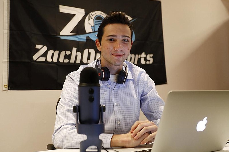 Zach Gershman, a Penn State sophomore, poses for a photograph in his basement studio in Philadel- phia. Gershman lost a paid summer internship covering The Northwoods collegiate baseball league for local Fox Sports affiliates in the Midwest. (AP/Matt Slocum) 
