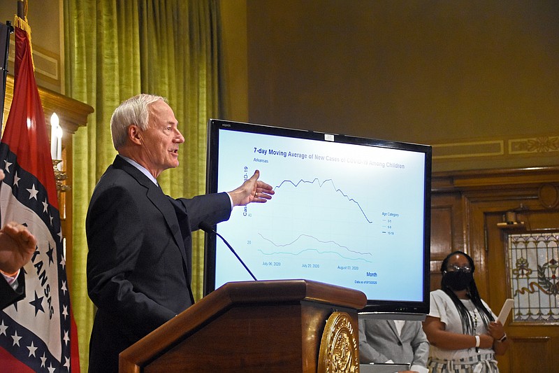 Gov. Asa Hutchinson talks about the number of COVID-19 cases among children during Thursday’s press briefing at the state Capitol in Little Rock. (Arkansas Democrat-Gazette/Staci Vandagriff)