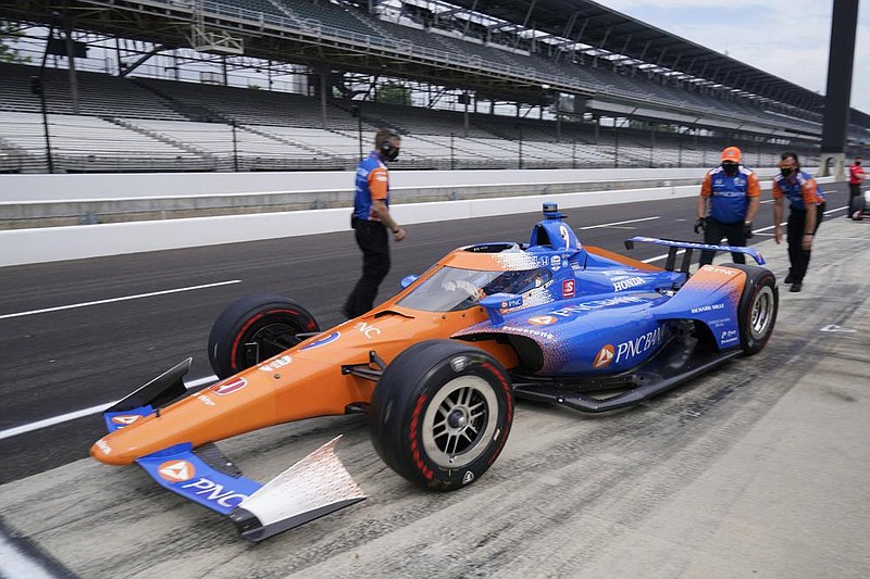 Scott Dixon pulls out of the pits Wednesday during the opening day of practice for next week’s Indianapolis 500. Dixon had the fastest lap of the day at an average speed of 224.047 mph.
(AP/Darron Cummings)