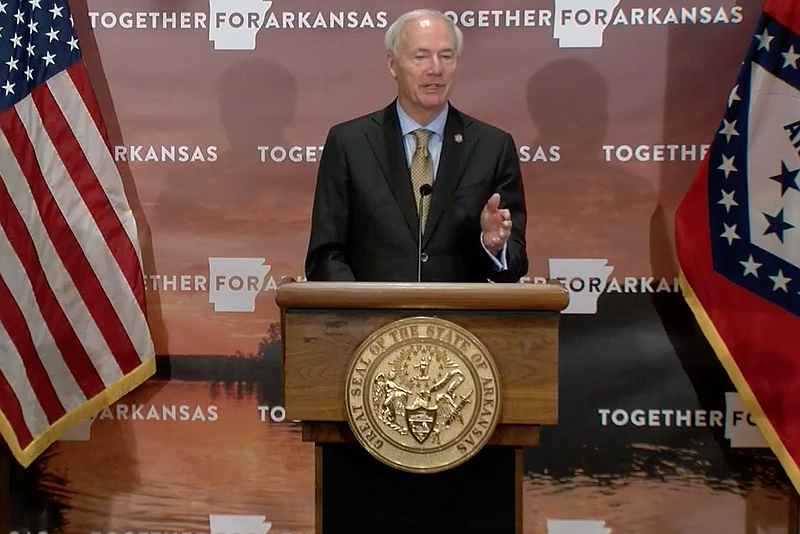 Arkansas Gov. Asa Hutchinson speaks to reporters at the state Capitol in Little Rock on Friday in this still of video provided by the governor's office. 
