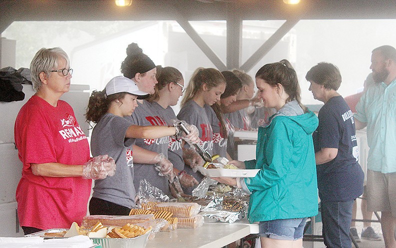 Last year, the Dardanelle High School cheerleading team helped the line move quickly and efficiently so patrons did not have to wait in long lines to get their food. This year, the annual Mount Nebo Chicken Fry will be drive-thru only and have a limited number of volunteers to help reduce the risk of spreading COVID-19.