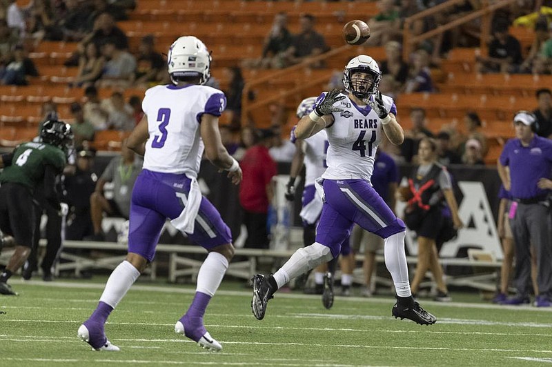 Central Arkansas tight end Joshua Nix (41) looks in a pass during the Bears’ game against Hawaii in September at Honolulu. On Thursday, the Southland Conference — of which UCA is a member — announced it would move all of its fall sports until the spring. However, school officials said UCA intends to play fall sports, including football, this fall.
(AP file photo)