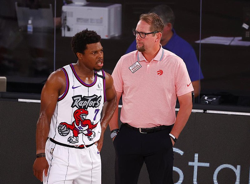 Toronto Raptors guard Kyle Lowry (left) leads the NBA in charges drawn for the second time in three years. It’s something that makes Coach Nick Nurse (right) cringe a little. “He knows how to do it just right. He usually bounces up,” Nurse said.
(AP/Kevin C. Cox)