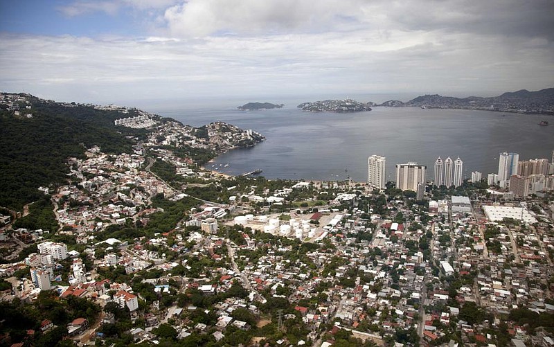 This 2013 file photo shows an aerial view of the Paci c resort city of Acapulco, Mexico. Mexico’s Pacific coast resort of Acapulco expressed hope Friday for a return of tourists, as the number of new coronavirus cases drop and the city’s violence that drove travelers away slowly declines. (AP/Eduardo Verdugo) 