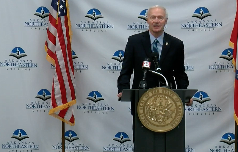 Arkansas Gov. Asa Hutchinson speaks to reporters in Blytheville on Tuesday in this still of video provided by the governor's office. 