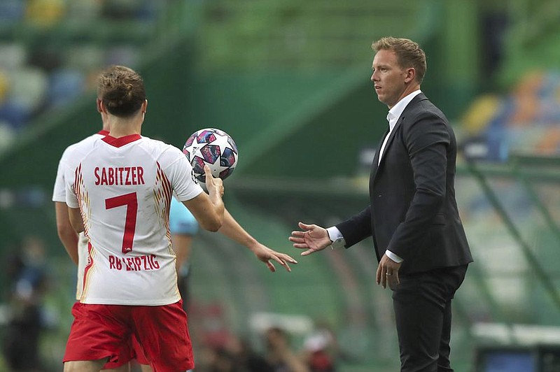 Julian Nagelsmann (right) has led Leipzig into the Champions League semifinals where the German team will face Paris Saint-Germain today in Lisbon, Portugal. (AP/Miguel A. Lopes) 
