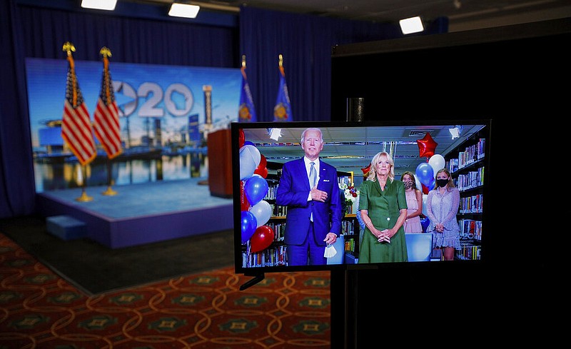 Democratic presidential candidate former Vice President Joe Biden is seen in a video feed from Delaware with his wife Jill Biden, and his grandchildren at his side, after winning the votes to become the Democratic Party's 2020 nominee for President, during the second night of the virtual 2020 Democratic National Convention in Milwaukee, Wisc., Tuesday, Aug. 18, 2020.