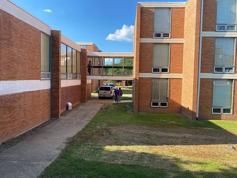 SAU staff are seen at Talbot Hall Wednesday afternoon. SAU President Trey Berry announced in an email to students Wednesdaythat Carrington Jackson, 22, a student at SAU passed away in his residence hall. (Rhett Gentry/Banner News)