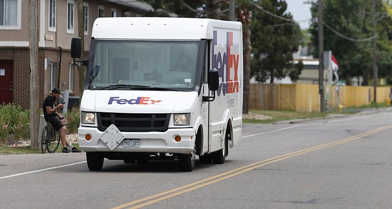 FedEx is preparing for the crush of holiday shipping by announc- ing special peak-season fees that will be in effect from Nov. 2 to Jan. 17. (AP/David Zalubowski) 