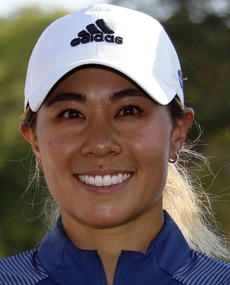 Danielle Kang poses with the trophy for winning the Marathon Classic LPGA golf tournament Sunday, Aug. 9, 2020, at the Highland Meadows Golf Club in Sylvania, Ohio. Kang shot a 15-under par for the tournament to win. (AP Photo/Gene J. Puskar)