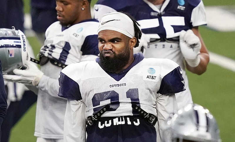 Dallas Cowboys running back Ezekiel Elliott is in training camp with the team despite not working out for a month when he was stricken with covid-19. AP/LM Otero) 