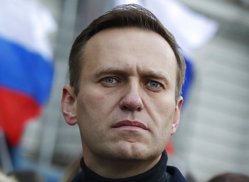 FILE - In this Feb. 29, 2020, file photo, Russian opposition activist Alexei Navalny takes part in a march in memory of opposition leader Boris Nemtsov in Moscow, Russia.