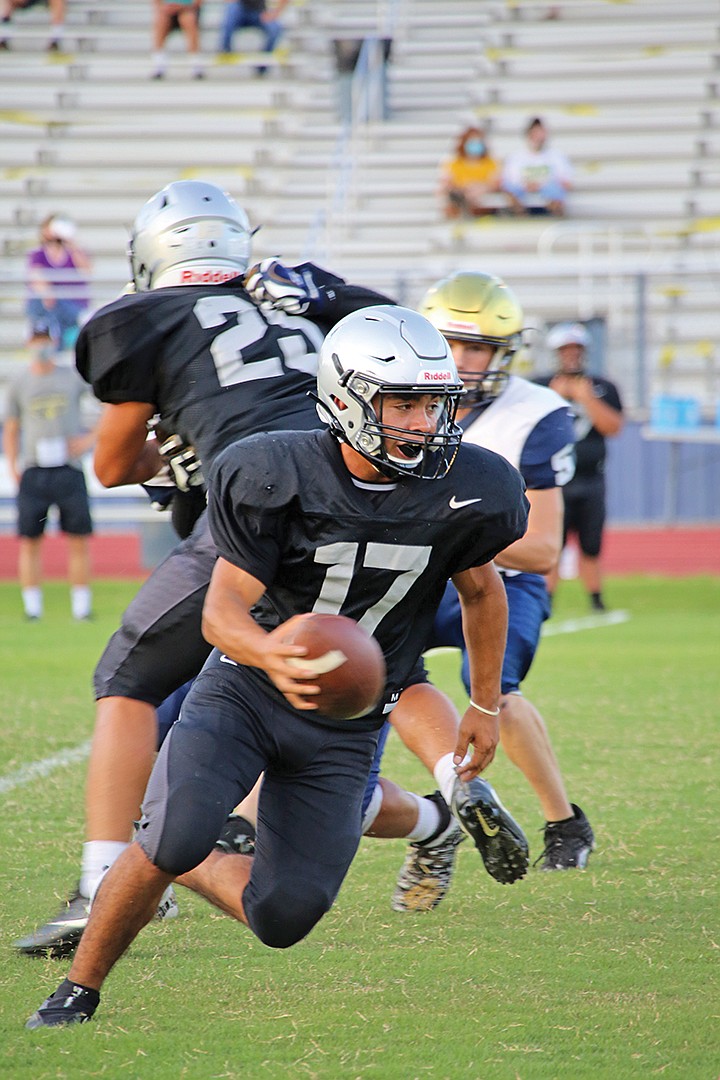 Riverview junior quarterback Israel Gameros finds some room to run during a scrimmage against Southside Batesville on Aug. 18.