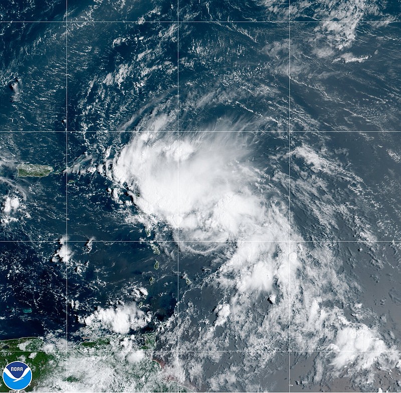 This satellite image released by the National Oceanic and Atmospheric Administration shows Tropical Storm Laura in the North Atlantic Ocean on Friday, Aug. 21, 2020. Laura formed Friday in the eastern Caribbean, and forecasters said it poses a potential hurricane threat to Florida and the U.S. Gulf Coast.