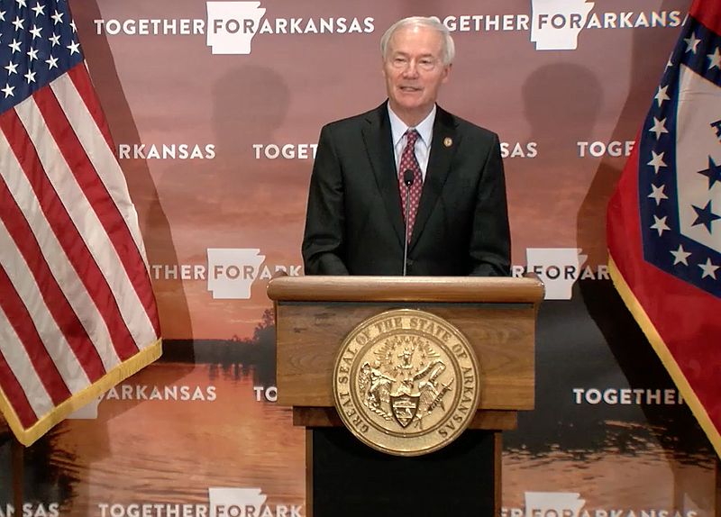 Arkansas Gov. Asa Hutchinson speaks to reporters at the state Capitol in Little Rock on Friday in this still of video provided by the governor's office. 
