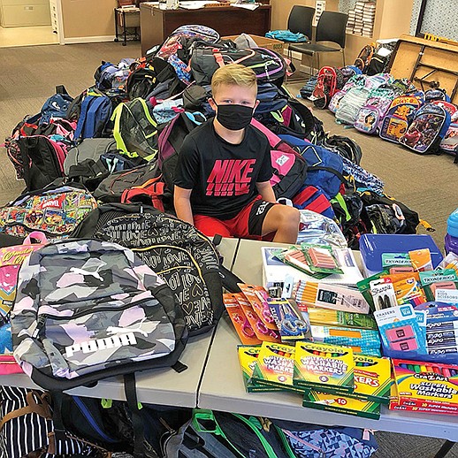 For the second birthday in a row, Emery McFarland, 9, of Searcy, asked his friends and family to gift school supplies instead of toys so he could donate the supplies to Stuff the Bus for the United Way of White County.