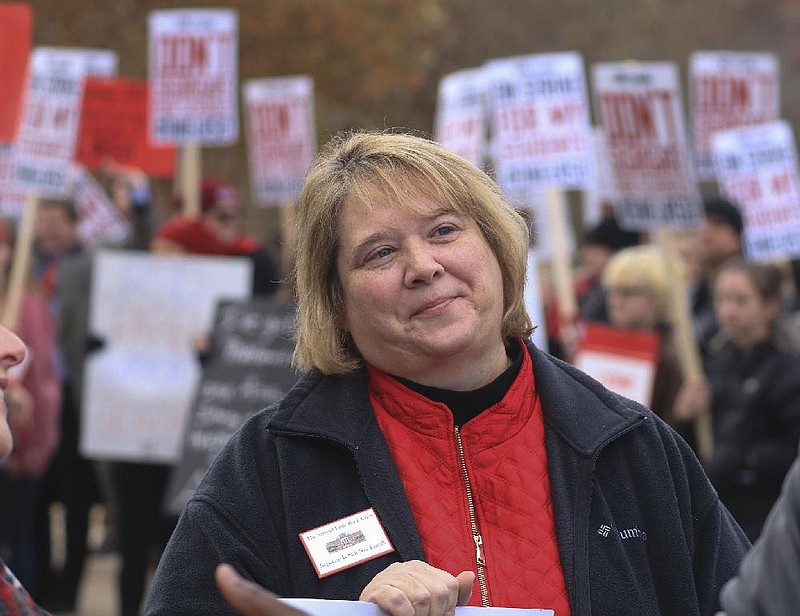 FILE — Little Rock Education Association President Teresa Knapp Gordon talks with teachers and supporters at Central High School as Little Rock School District employees held a one-day strike in this Nov. 14, 2019 file photo. 