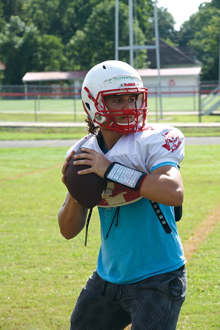 Atkins junior Zach Berkemeyer prepares to throw a pass at practice  Aug. 13. First-year head coach Matt Porter said Berkemeyer has a good arm and manages the game well.
