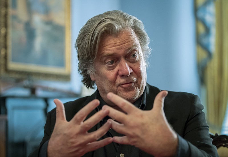 In this Aug. 19, 2018, file photo, Steve Bannon, President Donald Trump’s former chief strategist, talks during an interview with The Associated Press in Washington. Bannon has been arrested on charges that he and three others ripped off donors to an online fundraising scheme “We Build The Wall.” The charges were contained in an indictment unsealed Thursday in Manhattan federal court.