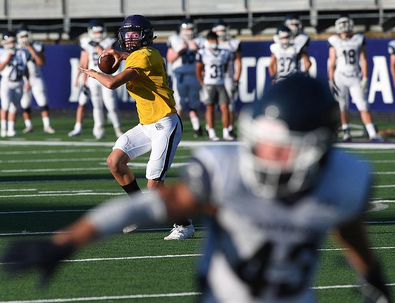 Fayetteville's Owen McCone drops back to pass against Greenwood Thursday August 20, 2020 during a scrimmage at Harmon Field in Fayetteville. Visit nwaonline.com/200820Daily/ for a photo gallery. (NWA Democrat-Gazette/J.T.WAMPLER) 