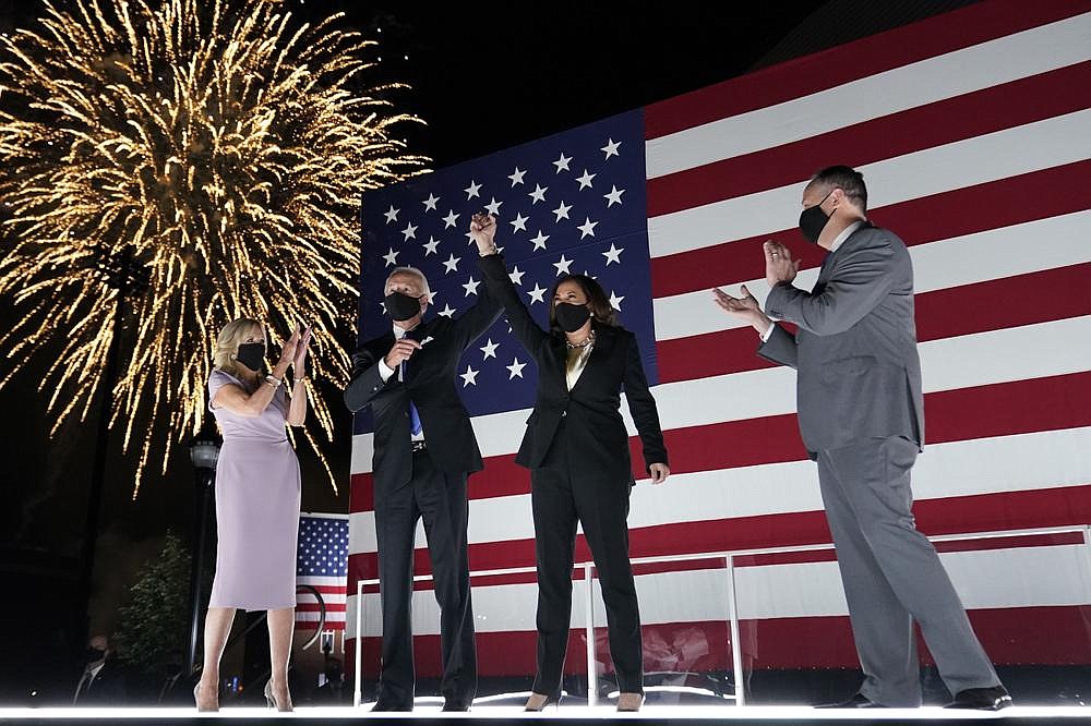 Joe Biden and his wife, Jill, watch fireworks with his running mate Sen. Kamala Harris and her husband, Doug Emhoff, as they celebrate Thursday night after Biden accepted the Democratic presidential nomination at the Chase Center in Wilmington, Del.
(AP/Andrew Harnik)