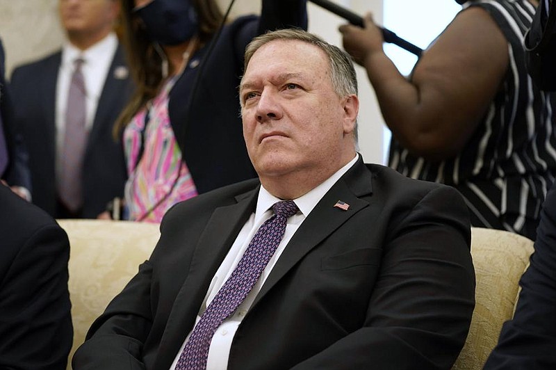 Secretary of State Mike Pompeo listens to a reporter's question during a meeting with President Donald Trump and Iraqi Prime Minister Mustafa al-Kadhimi in the Oval Office of the White House, Thursday, Aug. 20, 2020, in Washington. (AP Photo/Patrick Semansky)