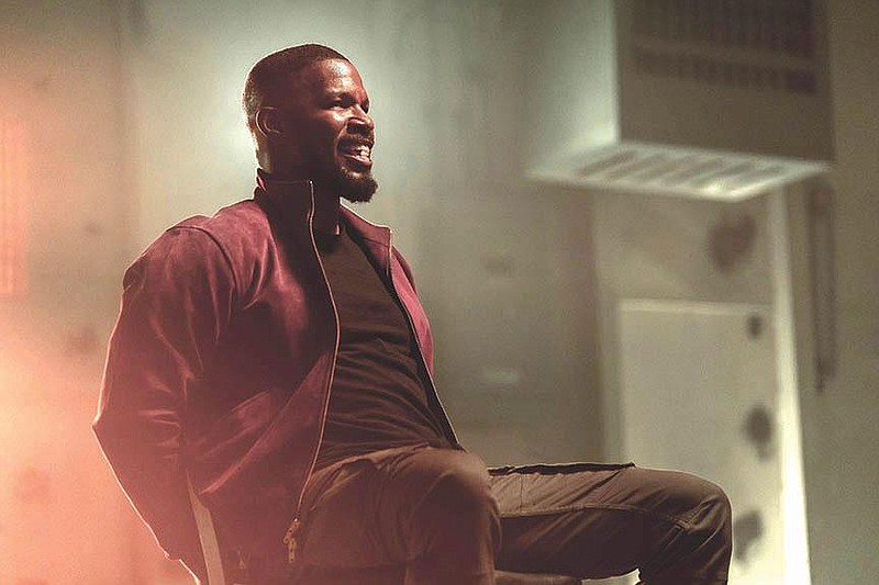 Art, aka The Major (Jamie Foxx) acquires the ability to launch directed, super-heated air that incinerates upon touch in the new Netflix movie “Project Power.”