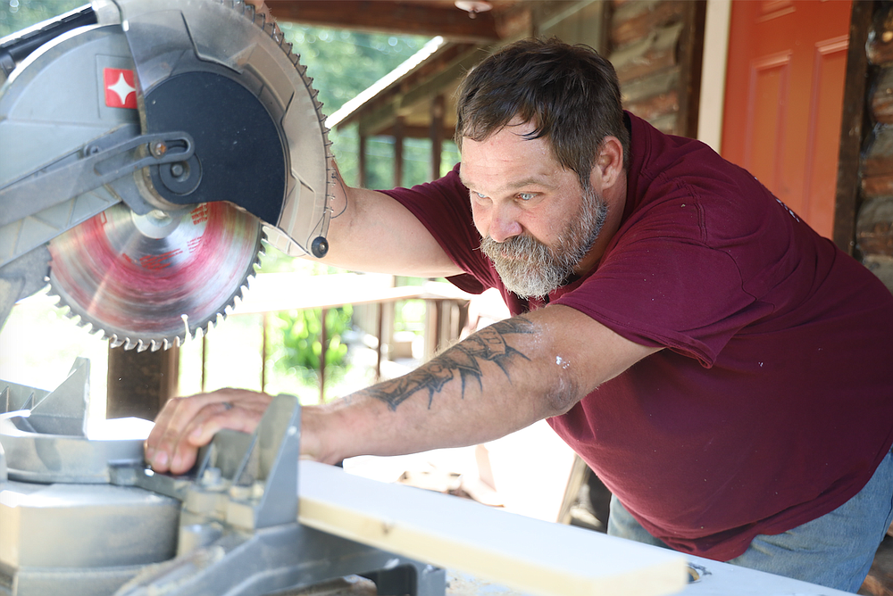 Chet Waters lines up a cut. The former inmate is working to build a new life after years of addiction and jail time.
(Special to the Democrat-Gazette/Dwain Hebda)