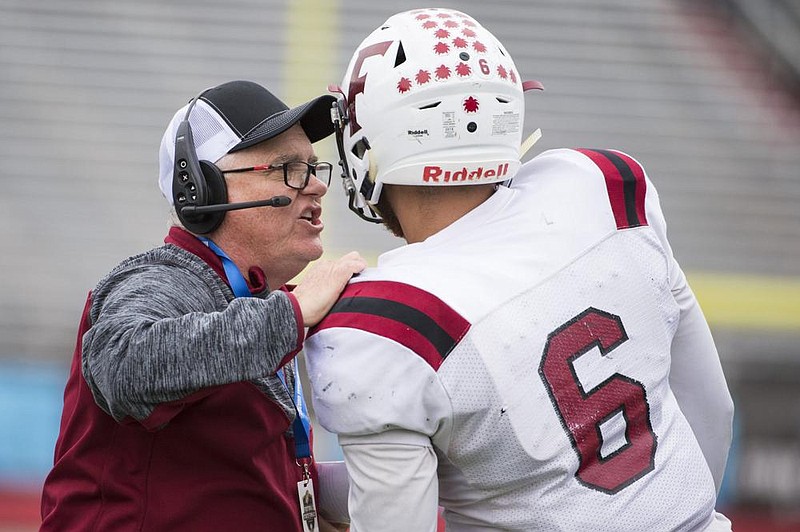 Fordyce Coach Timothy Rodgers gives instructions to quarterback Jaheim Brown during the Redbugs’ victory over Junction City in last season’s Class 2A championship game. The Redbugs are among the favorites to win the title again this season.
(Democrat-Gazette file photo)