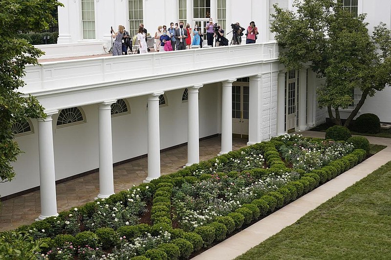 Journalists get an overhead view Saturday of the White House Rose Garden, which underwent a three-week makeover based on its original 1962 design and will serve as a backdrop for rst lady Melania Trump’s convention speech Tuesday night. More photos at arkansasonline.com/823rosegarden/. (AP/Susan Walsh) 