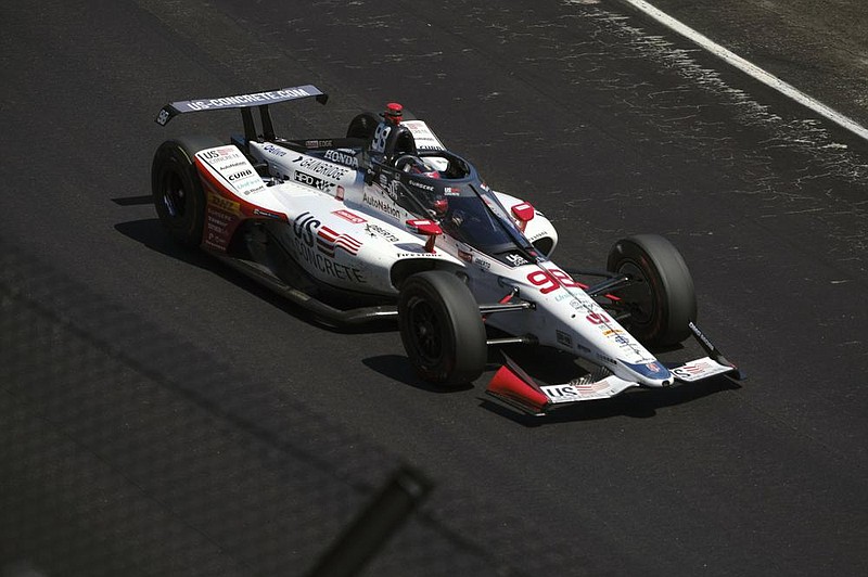 Marco Andretti drives into the first turn during the final practice session for the Indianapolis 500 on Friday. Andretti, whose grand- father Mario won the race in 1969, is the first Andretti to start on the pole since 1987. 
(AP Photo/AJ Mast) 