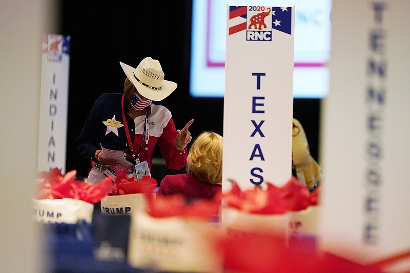 The room is set and delegates begin to arrive for the first day of the Republican National Convention, Monday, Aug. 24, 2020, in Charlotte, N.C.